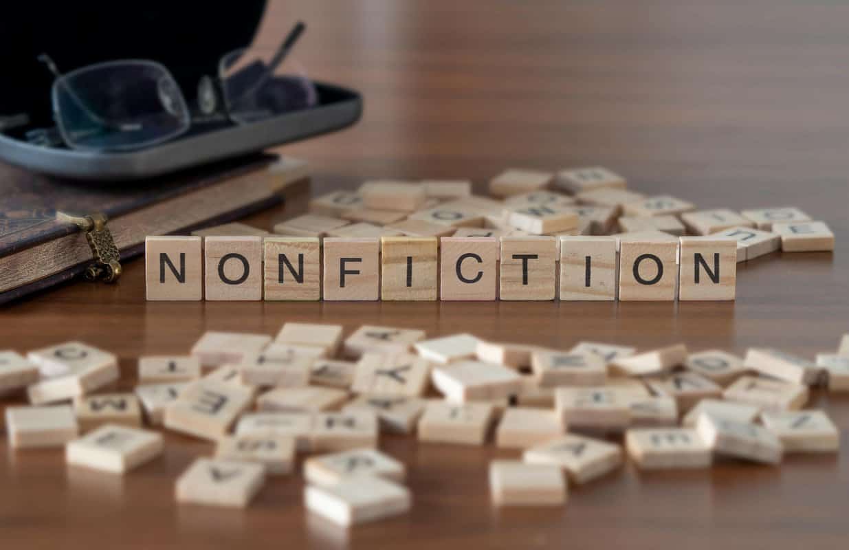 Scrabble tiles spell out 'Nonfiction' on a table.