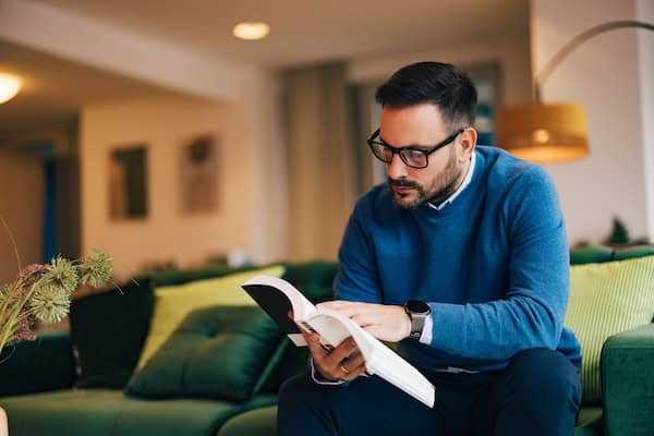 A person concentrating on reading a book