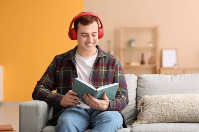 Person reading with headphones on
