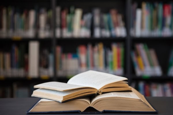 Close up of open books on table