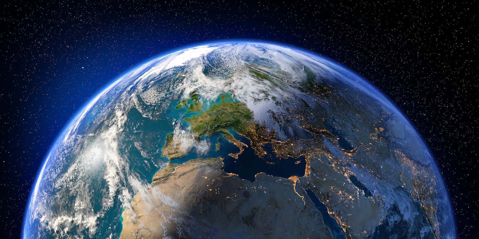 The earth viewed from space with the lights of cities visible.
